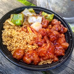 Lee's Kitchen - Combination Plate C4. Sweet and sour pork and pepper steak with fried rice. Comes with an egg roll. $11.95.