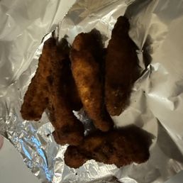 Dry burnt chicken fingers.