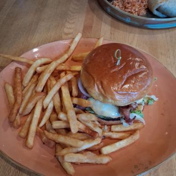 Malo - The milo burger and the side of fries - Latin American Near Me - Des Moines, Iowa