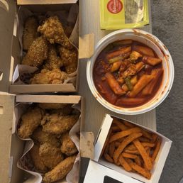 Crispy Fried Chicken with Sauce / 크리스피 양념치킨 (Honey Soy and Garlic), Sweet Potato Fries, Ddukbokki and free pickled radish. Crispy Fried Chicken with Sauce / 크리스피 양념치킨 (Honey Soy and Garlic), Sweet Potato Fries, Ddukbokki and free pickled radish.