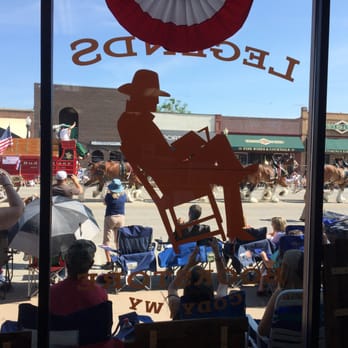 Legends Bookstore - a view of a parade through a window - Bookstores Near Me - Cody, Wyoming Legends Bookstore - a view of a parade through a window - Bookstores Near Me - Cody, Wyoming