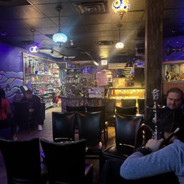 a man playing a hookah in a bar a man playing a hookah in a bar