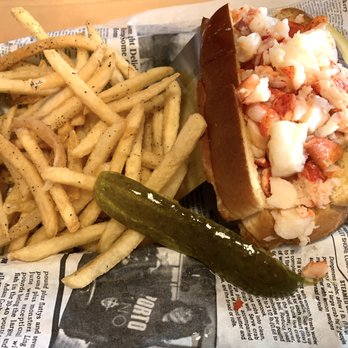 The Claw House - Lobster Roll (hand picked, chills meat in a grilled split top bun) tossed with warm butter, with fries and a pickle - Seafood Near Me - Murrells Inlet, South Carolina