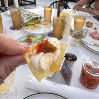 Bar Bucce - Money bite: graza chip with cheese and their spicy sauce - Beer Bar Near Me - Miami, Florida