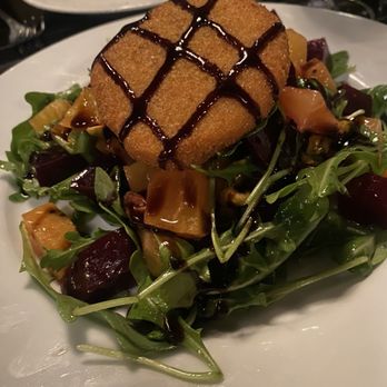 Forte Ristorante - A mixed green salad with diced vegetables, topped with a breaded, fried item and drizzled with balsamic glaze, served on a white plate. - Pizza Near Me - Hackensack, New Jersey