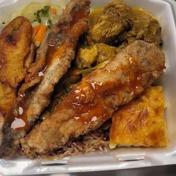 Spice Restaurant - Curry Chicken, Pan Fried Whiting, Rice & Peas, Cabbage, Macaroni & Cheese, and Plantain.  This combo was Crazy!