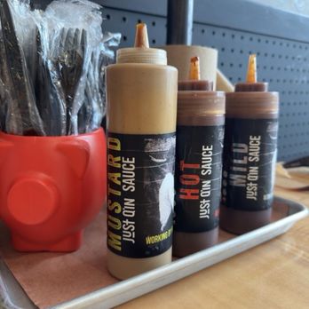 Just Q'in - Three sauces and a red pig full of plastic forks - Barbeque Near Me - Cincinnati, Ohio Just Q'in - Three sauces and a red pig full of plastic forks - Barbeque Near Me - Cincinnati, Ohio