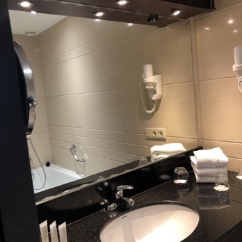 XO Hotels Blue Square - Nice spacious bathroom counter with toiletries and a blow dryer - Hotels Near Me - Amsterdam, New Hampshire XO Hotels Blue Square - Nice spacious bathroom counter with toiletries and a blow dryer - Hotels Near Me - Amsterdam, New Hampshire