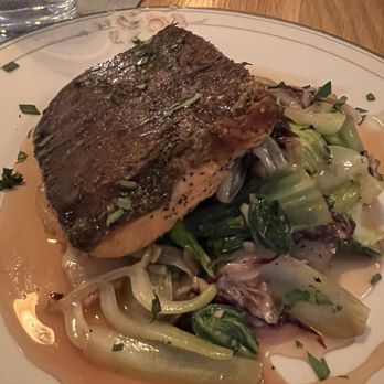 Kettle Black Kitchen - Salmon with braised veggies in a citrus sauce. Typically come with sweet peppers but I asked for none. 10/10. Get this! - French Near Me - Madison, Wisconsin