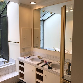 R F Construction - a bathroom with a tub and sink - General Contractors Near Me R F Construction - a bathroom with a tub and sink - General Contractors Near Me