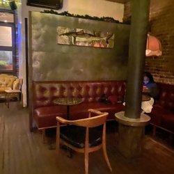Broken Land - Intimate seating wrapping behind the bar