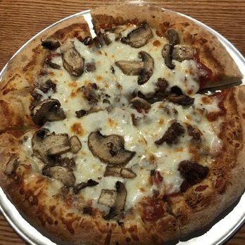 Old Chicago Pizza + Taproom - Sliced mushrooms, Italian sausage and roasted garlic. - Pizza Near Me - Manhattan, Kansas