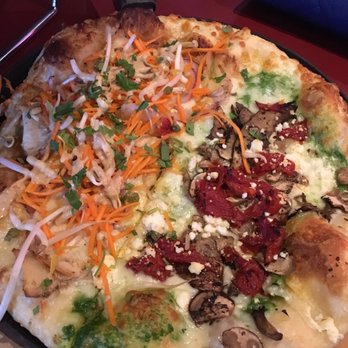 Moose's Tooth - Thai Chicken Pizza on the left and Wild Mushroom Pizza on the right. Both delicious! - Pizza Near Me - Anchorage, Alaska Moose's Tooth - Thai Chicken Pizza on the left and Wild Mushroom Pizza on the right. Both delicious! - Pizza Near Me - Anchorage, Alaska