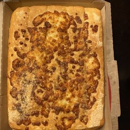 a pizza in a pizza box with sauce a pizza in a pizza box with sauce
