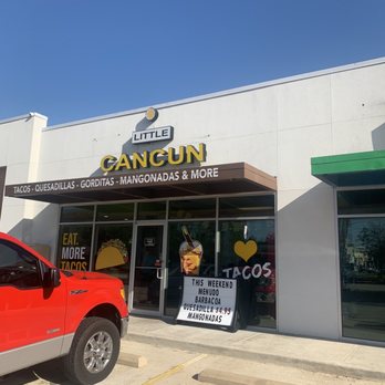 Little Cancun - a red truck parked in front of a store - Mexican Near Me - Humble, Texas Little Cancun - a red truck parked in front of a store - Mexican Near Me - Humble, Texas
