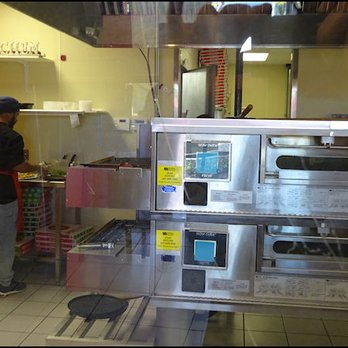 Chicago's Pizza With A Twist - There is a large commercial pizza oven that is the showcase of the kitchen. - Pizza Near Me - Roseville, California Chicago's Pizza With A Twist - There is a large commercial pizza oven that is the showcase of the kitchen. - Pizza Near Me - Roseville, California