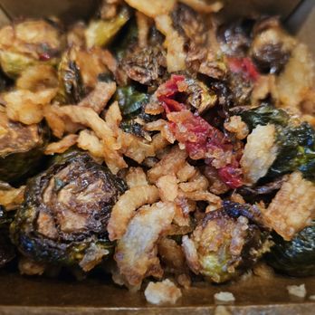 Johnny’s Garage - Crispy brussel sprouts: oven dried tomatoes, sweet garlic chili vinaigrette, & crispy onions. - New American Near Me - Hanahan, South Carolina Johnny’s Garage - Crispy brussel sprouts: oven dried tomatoes, sweet garlic chili vinaigrette, & crispy onions. - New American Near Me - Hanahan, South Carolina