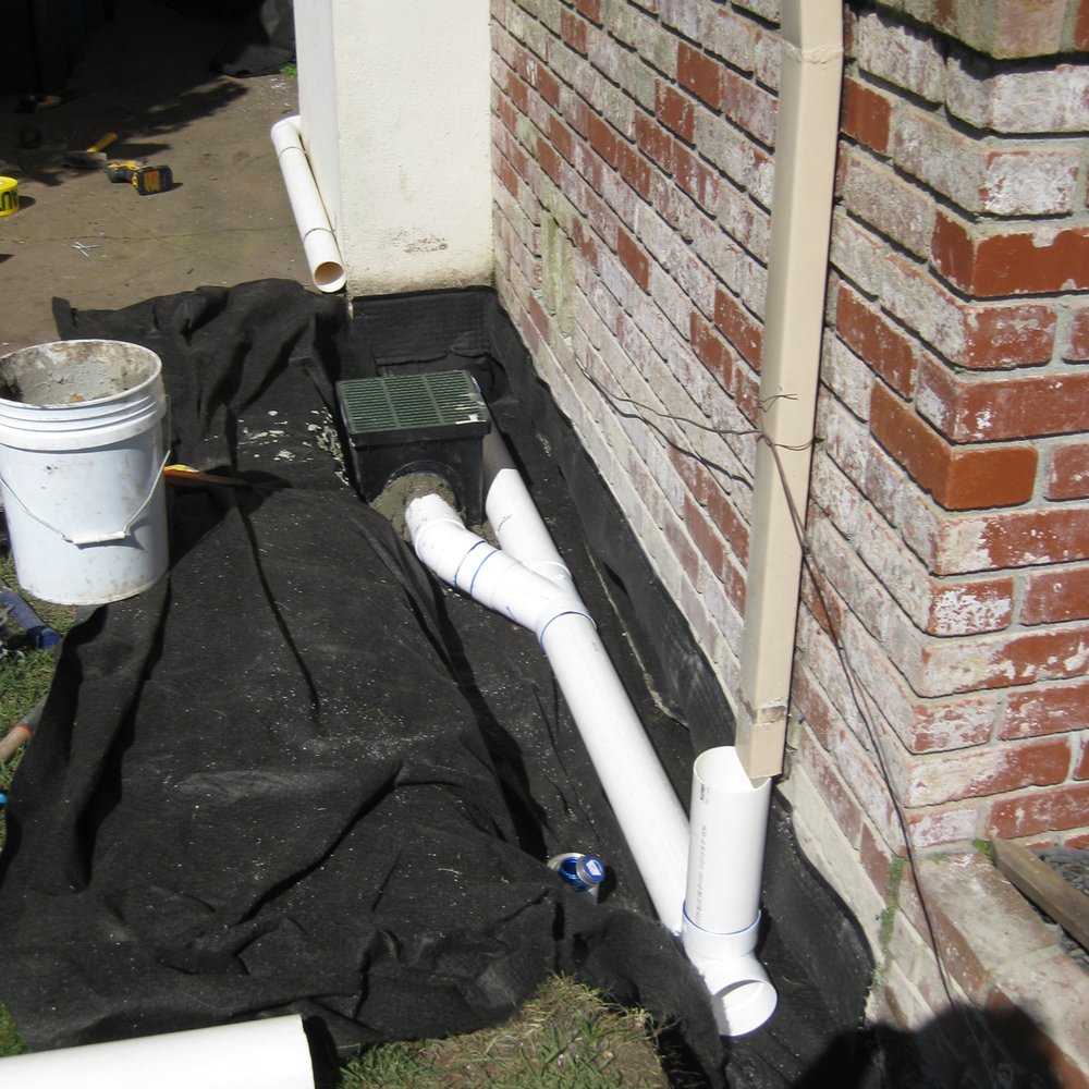 Catch basin with liner along the foundation. Catch basin with liner along the foundation.