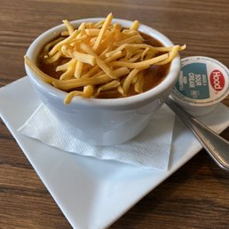 a bowl of chili and cheese a bowl of chili and cheese