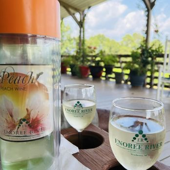 Enoree River Vineyards & Winery - Enjoying the peach wine on the back porch overlooking the vineyard! - Wineries Near Me - Newberry, South Carolina Enoree River Vineyards & Winery - Enjoying the peach wine on the back porch overlooking the vineyard! - Wineries Near Me - Newberry, South Carolina
