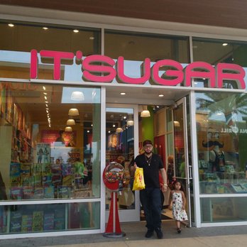 IT'SUGAR - a man and a woman walking out of a store - Candy Stores Near Me - Friendswood, Texas IT'SUGAR - a man and a woman walking out of a store - Candy Stores Near Me - Friendswood, Texas