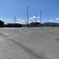 Veterans Memorial Soccer Complex - Parking lot with ball field with lights.