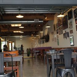 Brigid's Bottleshop - Outside looking in. The purple om the right are booths with dividers between each of them.