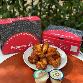 Pepperoni's - Fulshear - a plate of chicken wings and dips - Pizza Near Me - Fulshear, Texas Pepperoni's - Fulshear - a plate of chicken wings and dips - Pizza Near Me - Fulshear, Texas