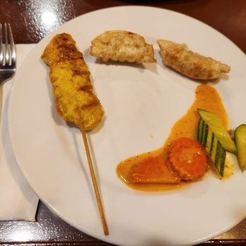 Thailand Restaurant - My plate of chicken satay, potstickers, and veggies from the chicken penang (carrots and zucchini). - Thai Near Me - Modesto, California