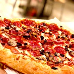 Pizza Hut - Pepperoni Lover's Pizza with mushrooms, black olives and bacon. Stuffed crust too!