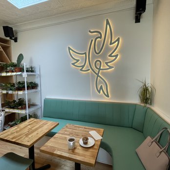 Phoenix Coffee - a green couch and a wooden table - Coffee & Tea Near Me - Lakewood, Ohio Phoenix Coffee - a green couch and a wooden table - Coffee & Tea Near Me - Lakewood, Ohio