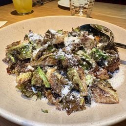 Brussels sprouts - Honeycrisp apple, black currants, Pecorino Romano, pine nuts, lemon-garlic vinaigrette Brussels sprouts - Honeycrisp apple, black currants, Pecorino Romano, pine nuts, lemon-garlic vinaigrette