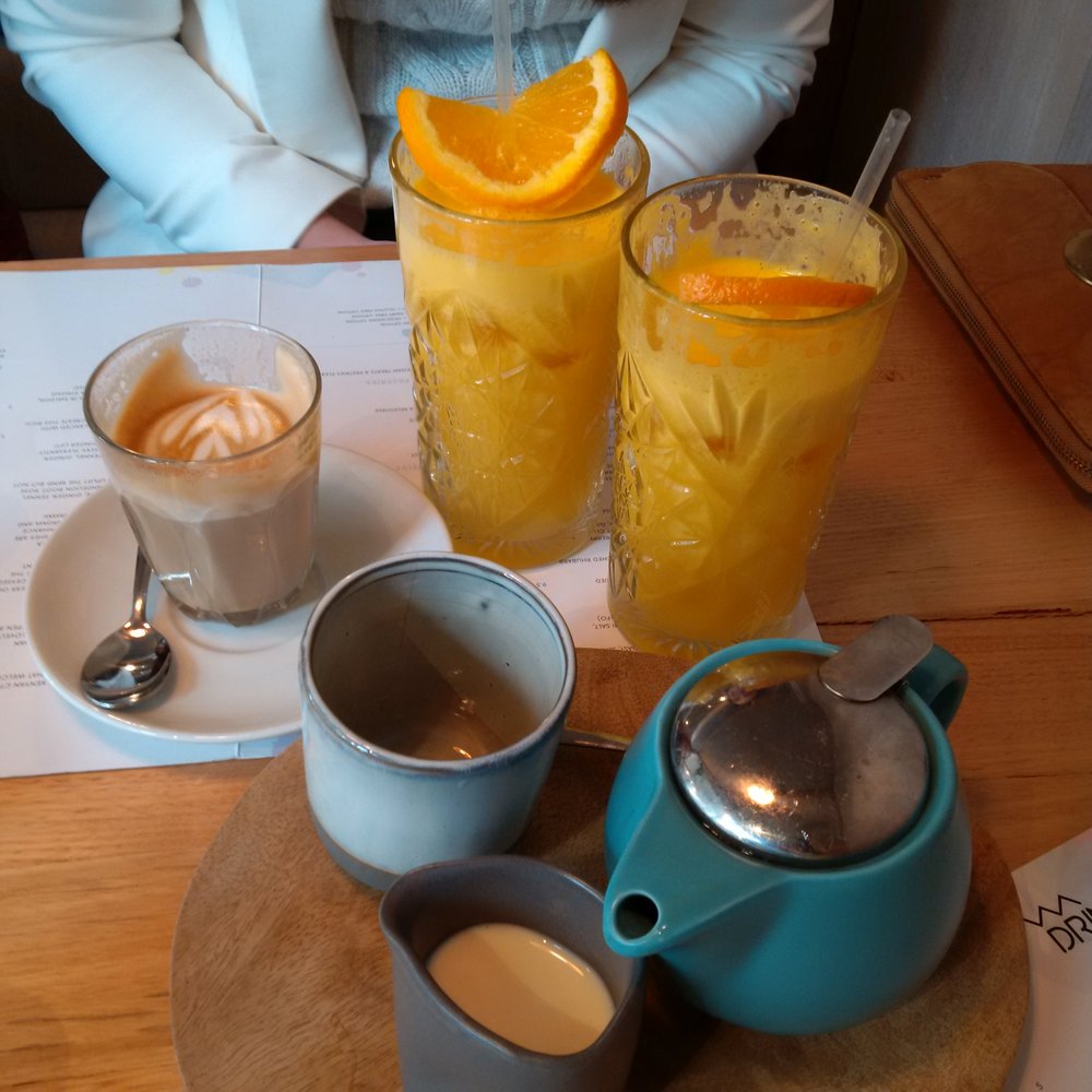 Freshly squeezed orange juices and a tea and latte