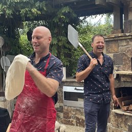 Fun guys making pizza