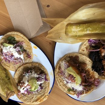 Tlaolli - Our food. Two tacos and a tamale each. - Mexican Near Me - Indianapolis, Indiana