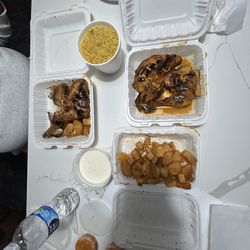 The Port of Peri Peri - Whole chicken meal half milder milder sauce and half lemon and herb sauce and large side of cassava fries