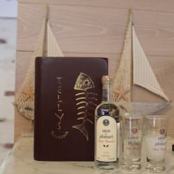 Telly's Taverna - Ouzo Plomari, the greatest companion to our grilled Octopus!