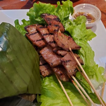 Banana Bay Restaurant - #42 .pork skewers...soooo good...sticky rice wrapped in banana leaves ..beautfully wrapped...pork was divine...sauce spicy!! - Thai Near Me - Temple City, California Banana Bay Restaurant - #42 .pork skewers...soooo good...sticky rice wrapped in banana leaves ..beautfully wrapped...pork was divine...sauce spicy!! - Thai Near Me - Temple City, California