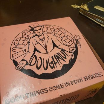 Voodoo Doughnut - The pink box. Excuse the warping. It was raining that evening. - Donuts Near Me - Tempe, Arizona
