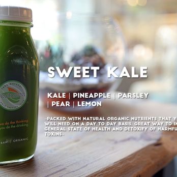 Revitasize - a bottle of green juice on a table - Juice Bars & Smoothies Near Me - Aurora, Ontario