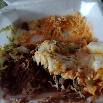El Indio Mexican Restaurant - Half eaten asada burrito with rice and beans. This was a delivery order and the beans slid under the burrito. - Mexican Near Me - Melbourne, Florida El Indio Mexican Restaurant - Half eaten asada burrito with rice and beans. This was a delivery order and the beans slid under the burrito. - Mexican Near Me - Melbourne, Florida