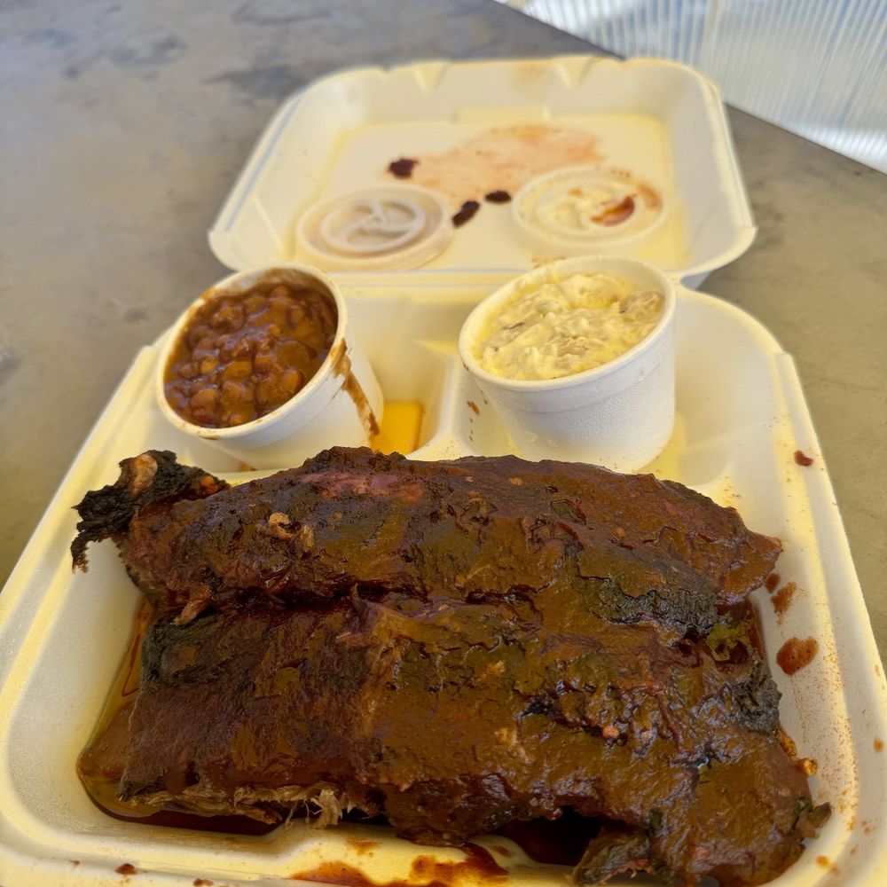 Beef ribs, chopped beef brisket, potato salad and baked beans Beef ribs, chopped beef brisket, potato salad and baked beans