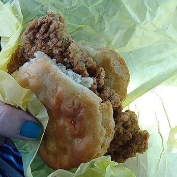 Dodge's Southern Style - a person holding a fried chicken sandwich - Convenience Stores Near Me - Hendersonville, Tennessee