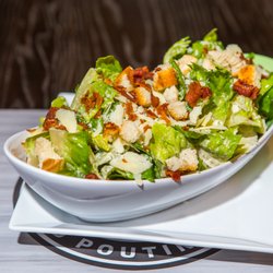 Stuft Burger Bar & Poutinerie - 1 of 3 available salads! Our huge caesar salads are a meal themselves. Made with our house-made dressings, croutons, and apple wood bacon!