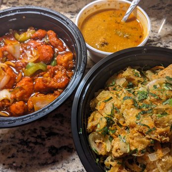 Cafe Nova - Food to go: chilli curry (red), kothu roti (bottom right), which came with chicken curry (top) to top it with. - Sri Lankan Near Me - Chicago, Illinois
