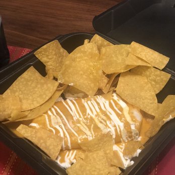 Tijuana Flats - Chicken Tinga Chimichanga with queso on top - Tex-Mex Near Me - Cooper City, Florida Tijuana Flats - Chicken Tinga Chimichanga with queso on top - Tex-Mex Near Me - Cooper City, Florida