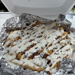 Hilltop Market and Pizzeria - Loaded fries add homemade ranch drizzle