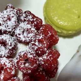Raspberry tart, vanilla eclair and a pistacho macaron