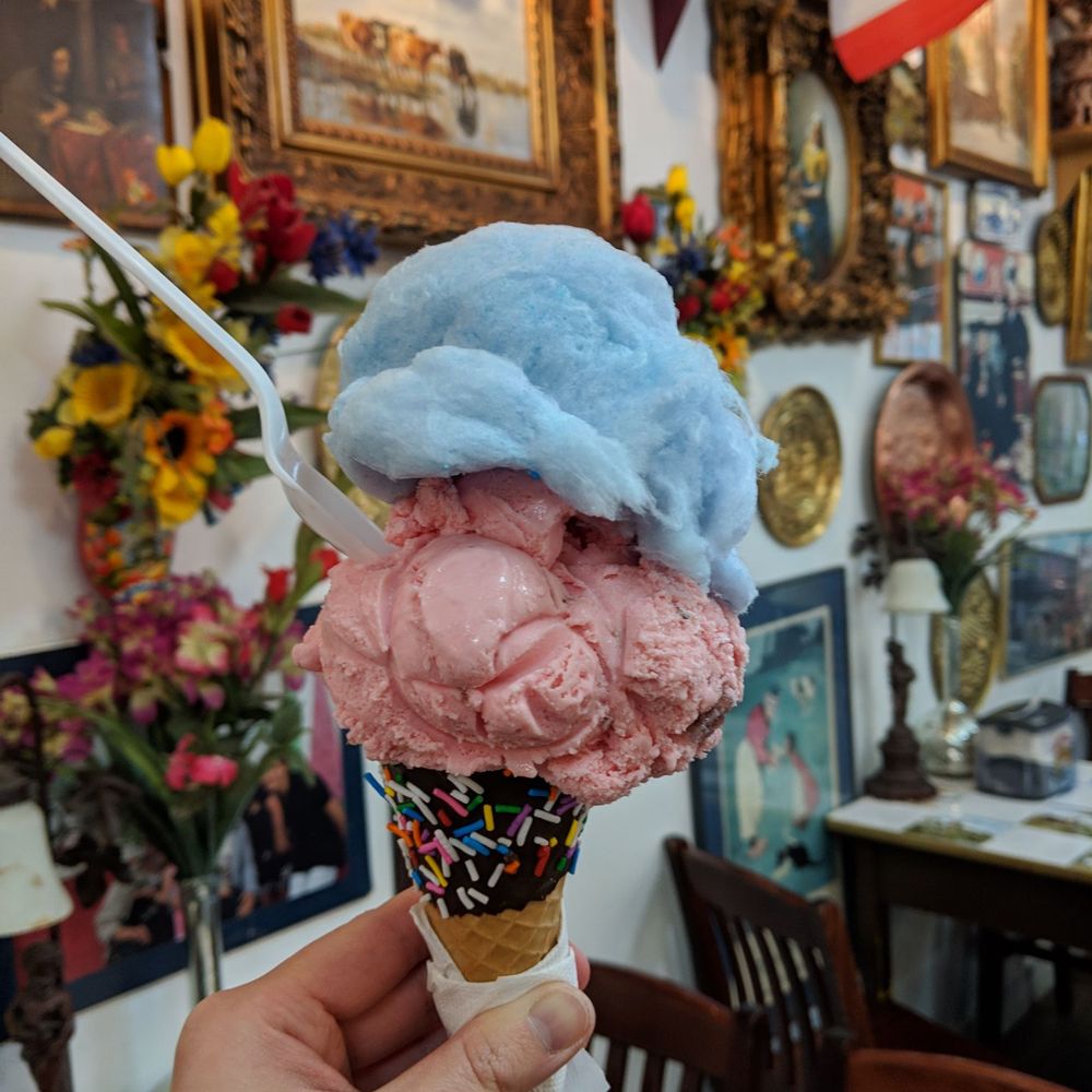 Dutch Dreams - A large scoop of strawberry ice cream and a generous fluff of cotton candy (free topping!) all precariously balanced on a tiny cone. - Ice Cream & Frozen Yogurt Near Me - Toronto, Ontario Dutch Dreams - A large scoop of strawberry ice cream and a generous fluff of cotton candy (free topping!) all precariously balanced on a tiny cone. - Ice Cream & Frozen Yogurt Near Me - Toronto, Ontario
