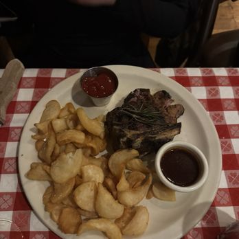 The Angus Barn - Bone in filet mignon with fries. Those fries are so unique and they were really crispy and tasty. - Steakhouses Near Me - Raleigh, North Carolina